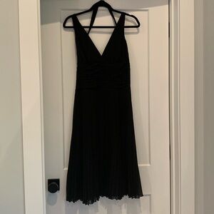 Black evening dress. Pleated skirt and sexy (yet demure!) top.